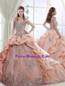 Elegant Brush Train Peach Quinceanera Gown with Appliques and Bubbles