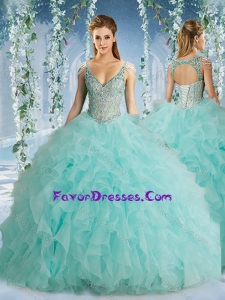 Popular Hot Beaded Decorated Cap Sleeves Quinceanera Gown with Deep V Neck