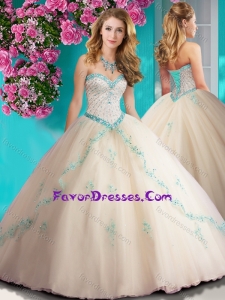 Elegant Beaded and Applique Tulle Quinceanera Gowns in Champagne