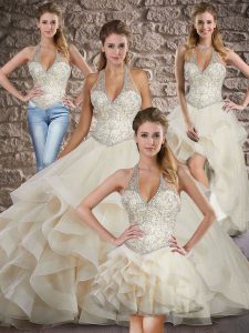 Ideal Champagne Halter Top Neckline Beading and Ruffles Quinceanera Gown Sleeveless Lace Up