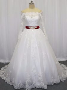Enchanting White Tulle Clasp Handle Wedding Dress Long Sleeves Brush Train Beading and Lace and Belt