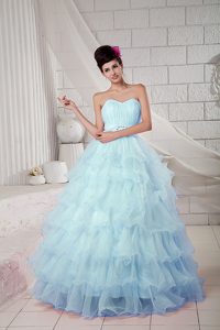 Glitz Ruching Organza Quince Dresses with Ruffles and Beads in Light Blue
