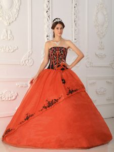 Rust Red and Black Quinceanera Gown with Handmade Flowers and Embroidery