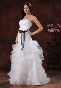 Sweetheart Garden Wedding Dress with Ruffled Layers and Black Sash