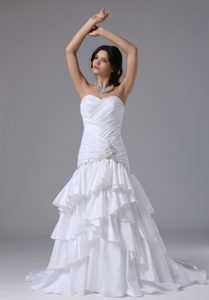 Luxurious Ruched Mermaid Court Train Wedding Dress with Ruffled Layers